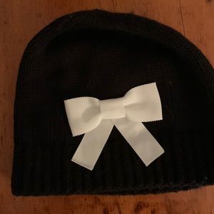 Kate Spade Black Knit hat with white bow.